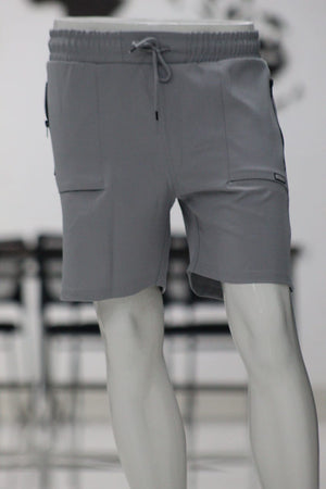 Gray shorts on a mannequin with a blurred background