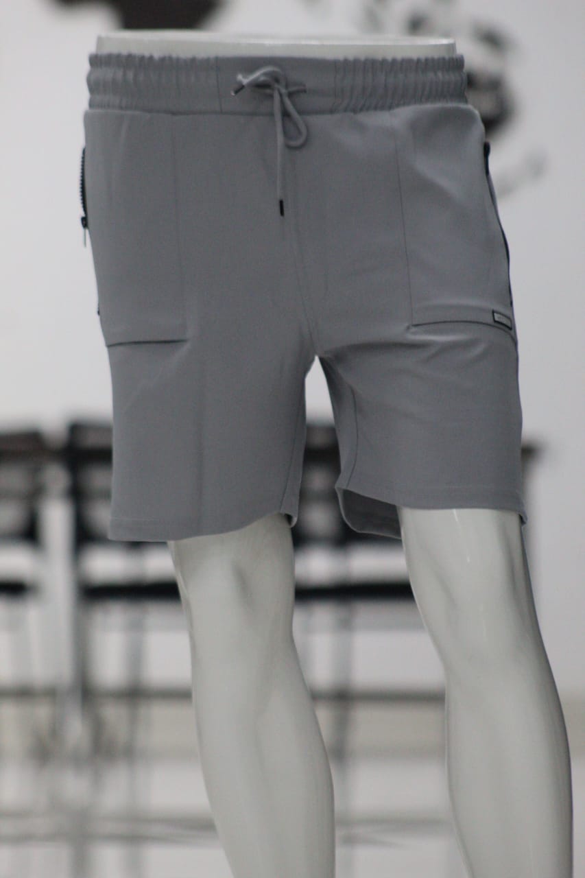 Gray shorts on a mannequin with a blurred background